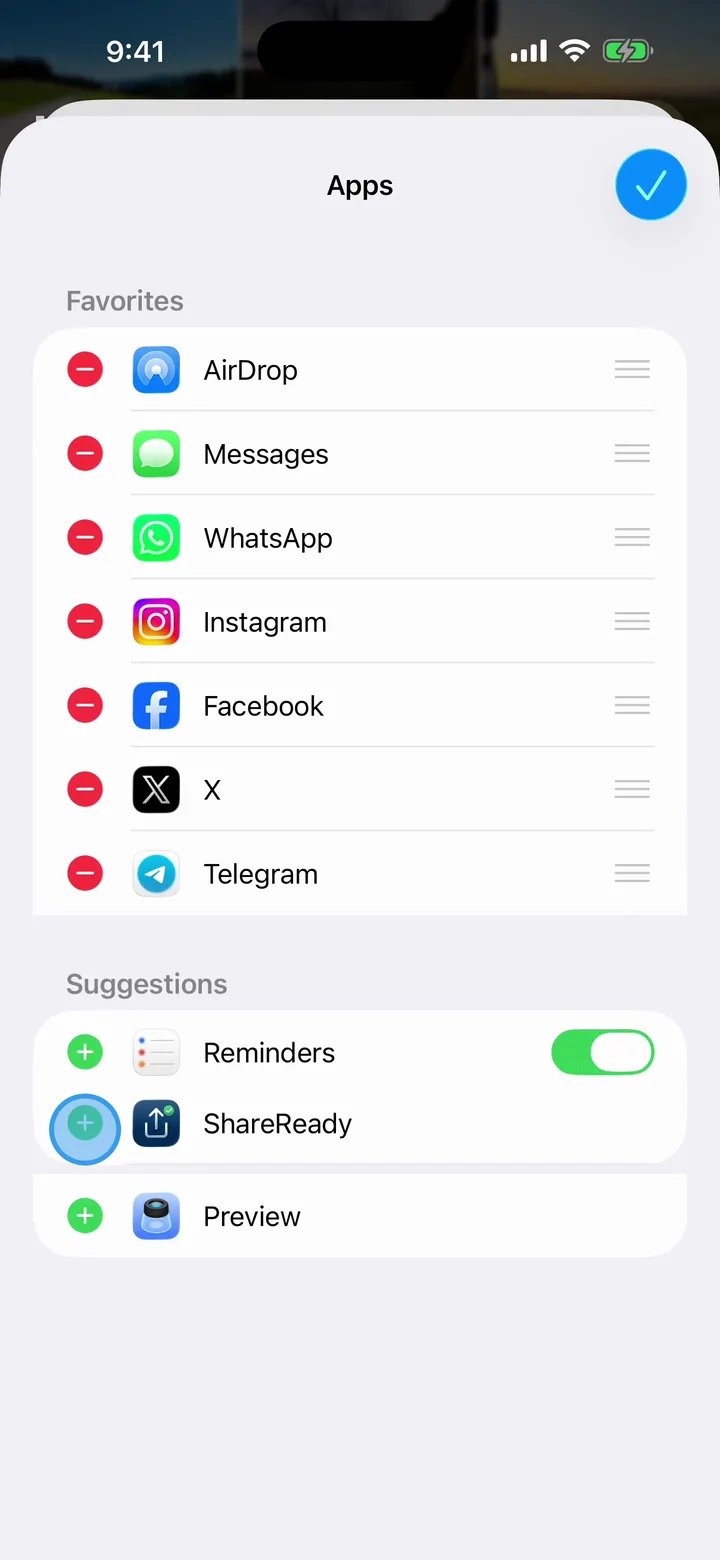 The Apps screen in edit mode. Favorites show red minus buttons and drag handles, and the green plus next to ShareReady under Suggestions is highlighted.